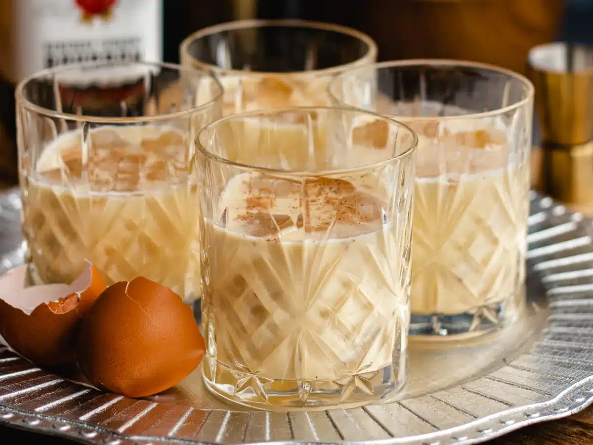 Four rocks glasses filled with a creamy cocktail.