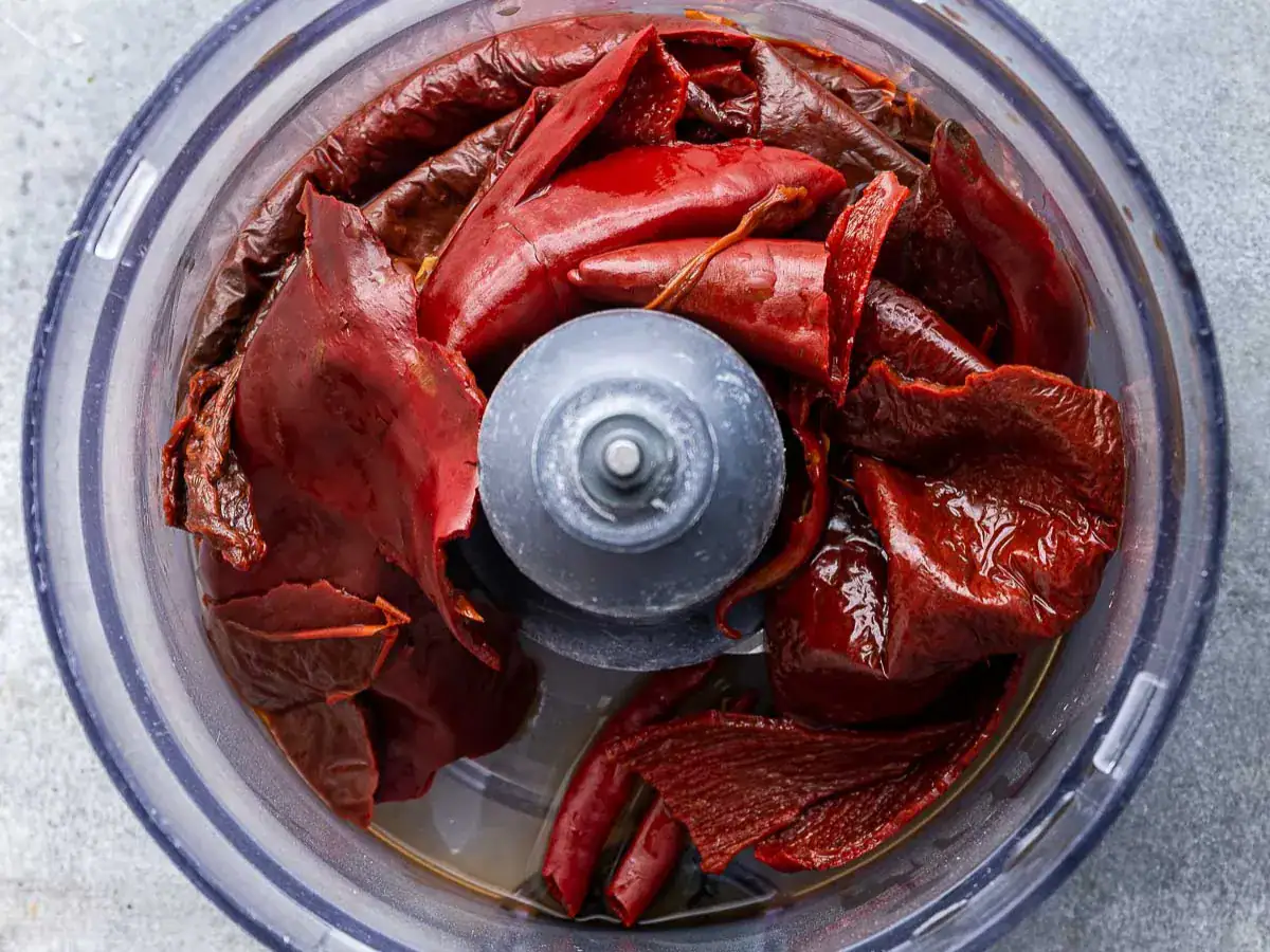 Hydrated peppers in food processor.
