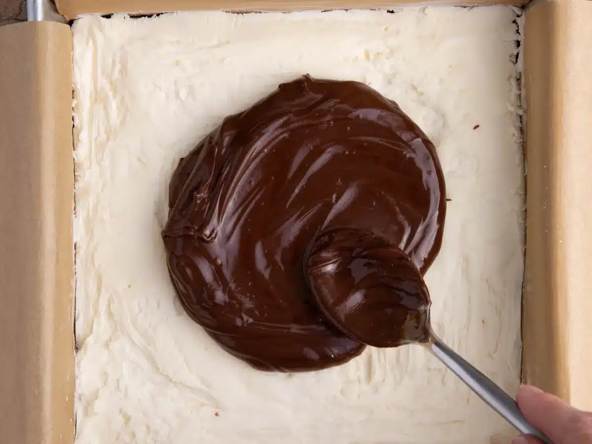 Chocolate layer spread on top of custard layer.