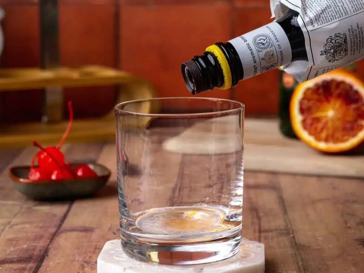 Simple syrup and bitters in rocks glass.