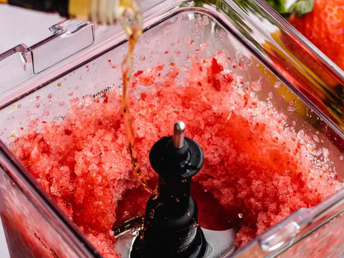 Rum being poured into blender.