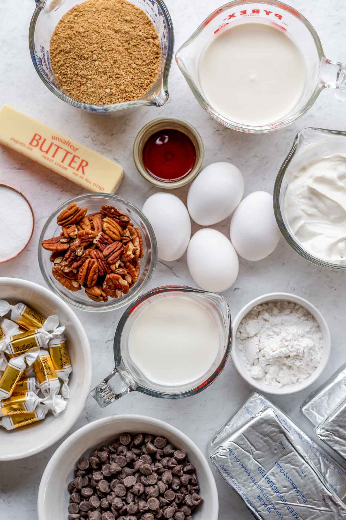 Turtle Cheesecake ingredients in separate bowls