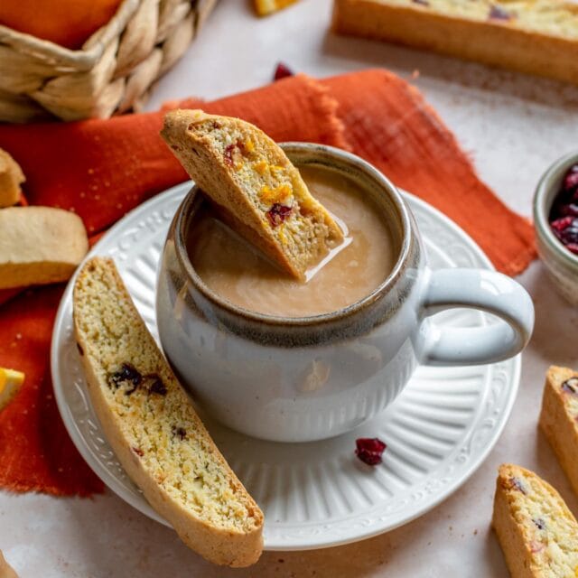 Cranberry Orange Biscotti Cookie dipped in teacup