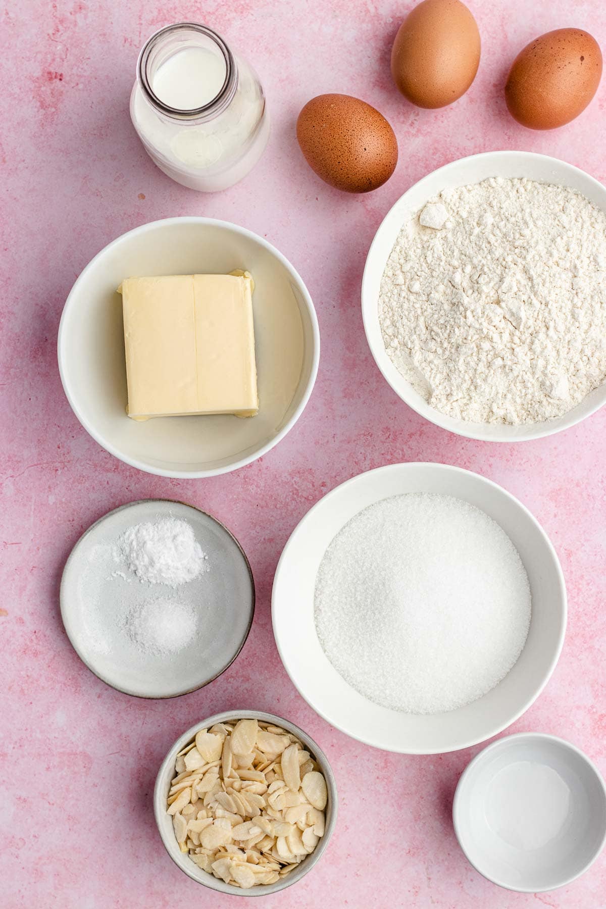 Almond Pound Cake ingredients laid out in bowls and eggs