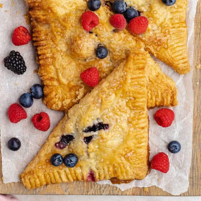 Berry turnovers on serving board.