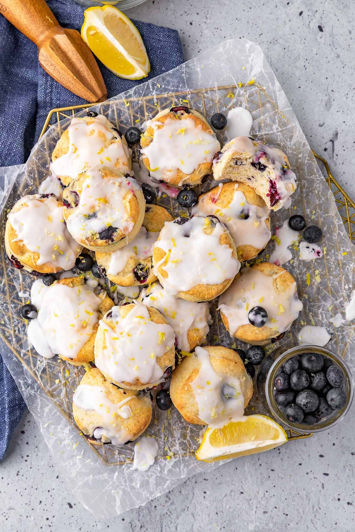 Lemon Blueberry Biscuits baked and glazed biscuits stacked on plate