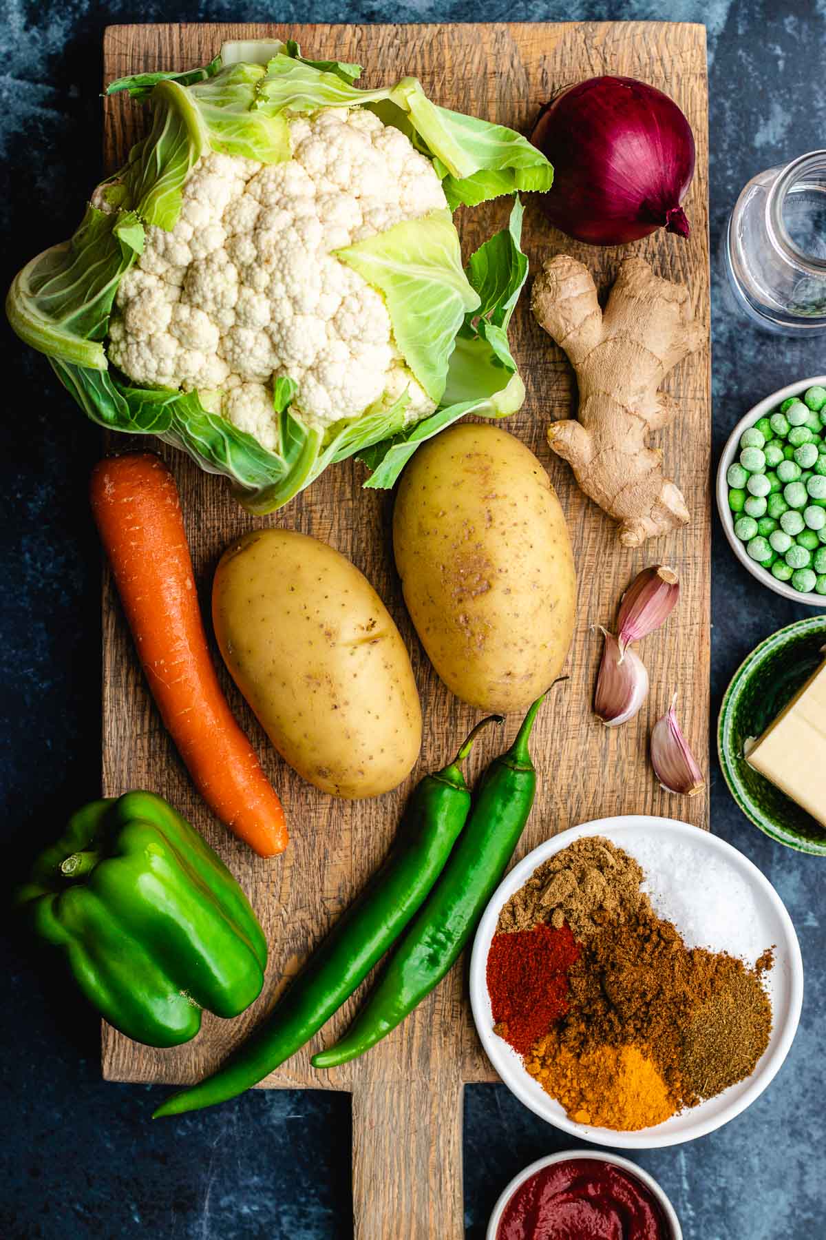 Pav Bhaji ingredients separated on cutting board