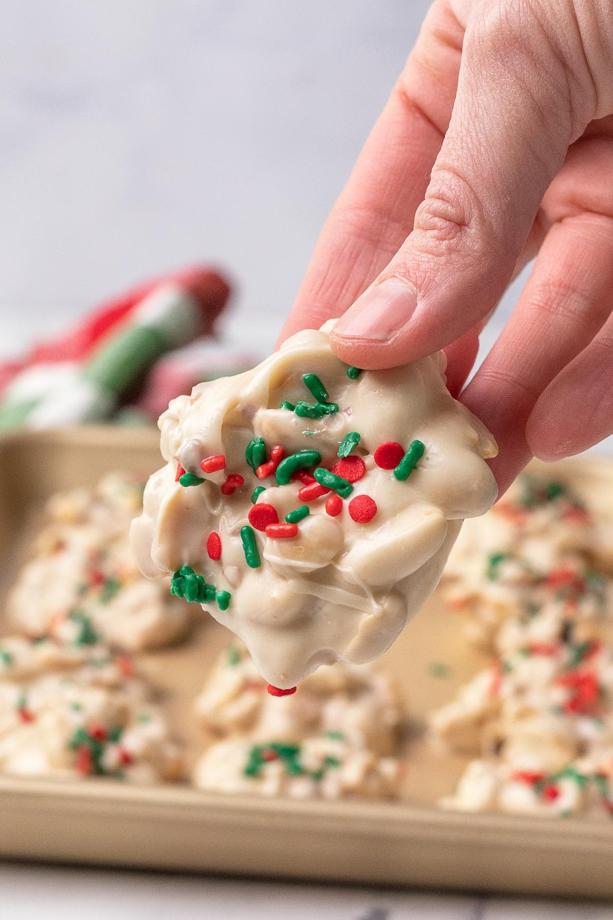Slow Cooker White Chocolate Clusters in hand