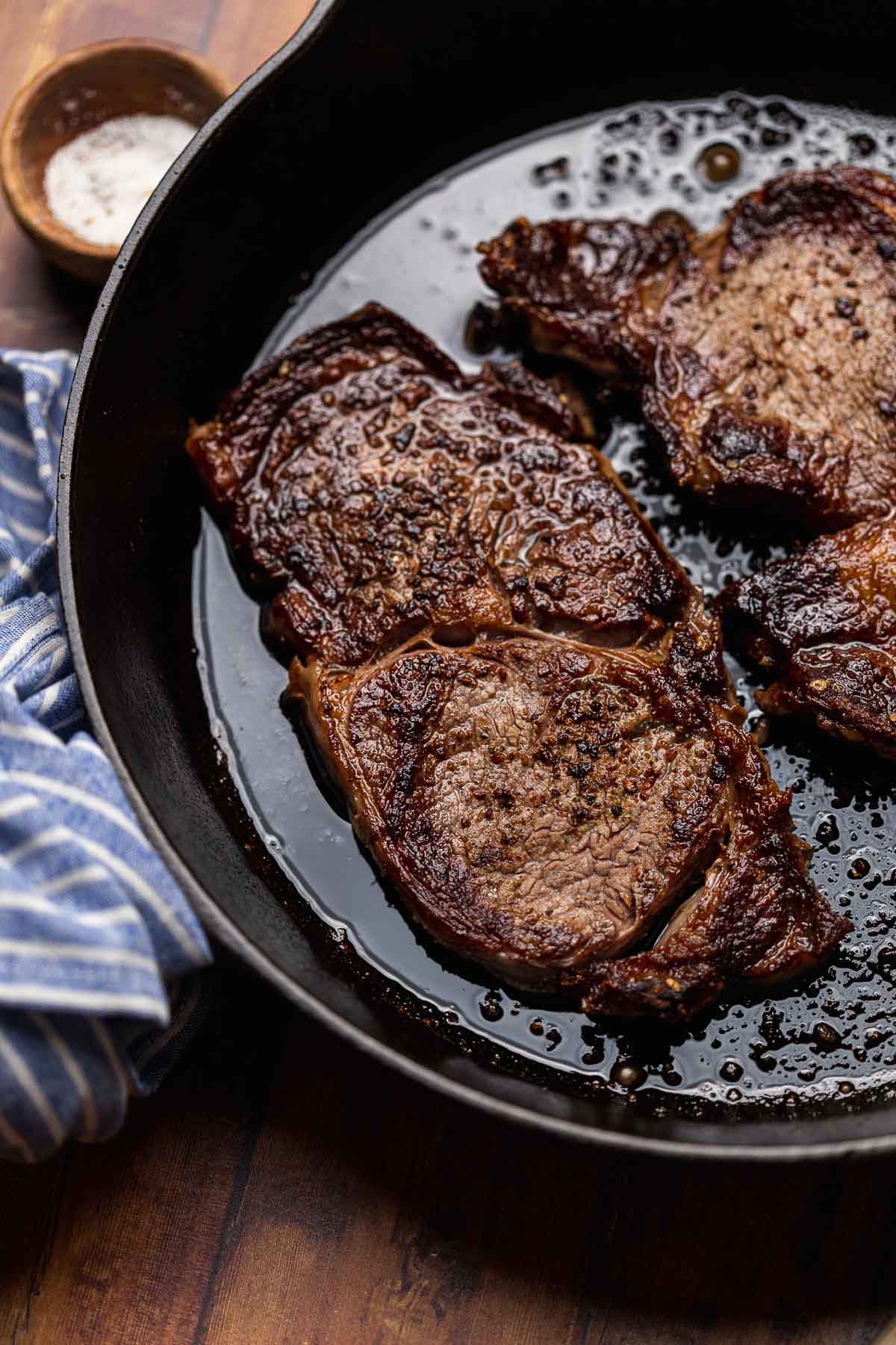 Steak Salad cooked steaks in cast iron skillet