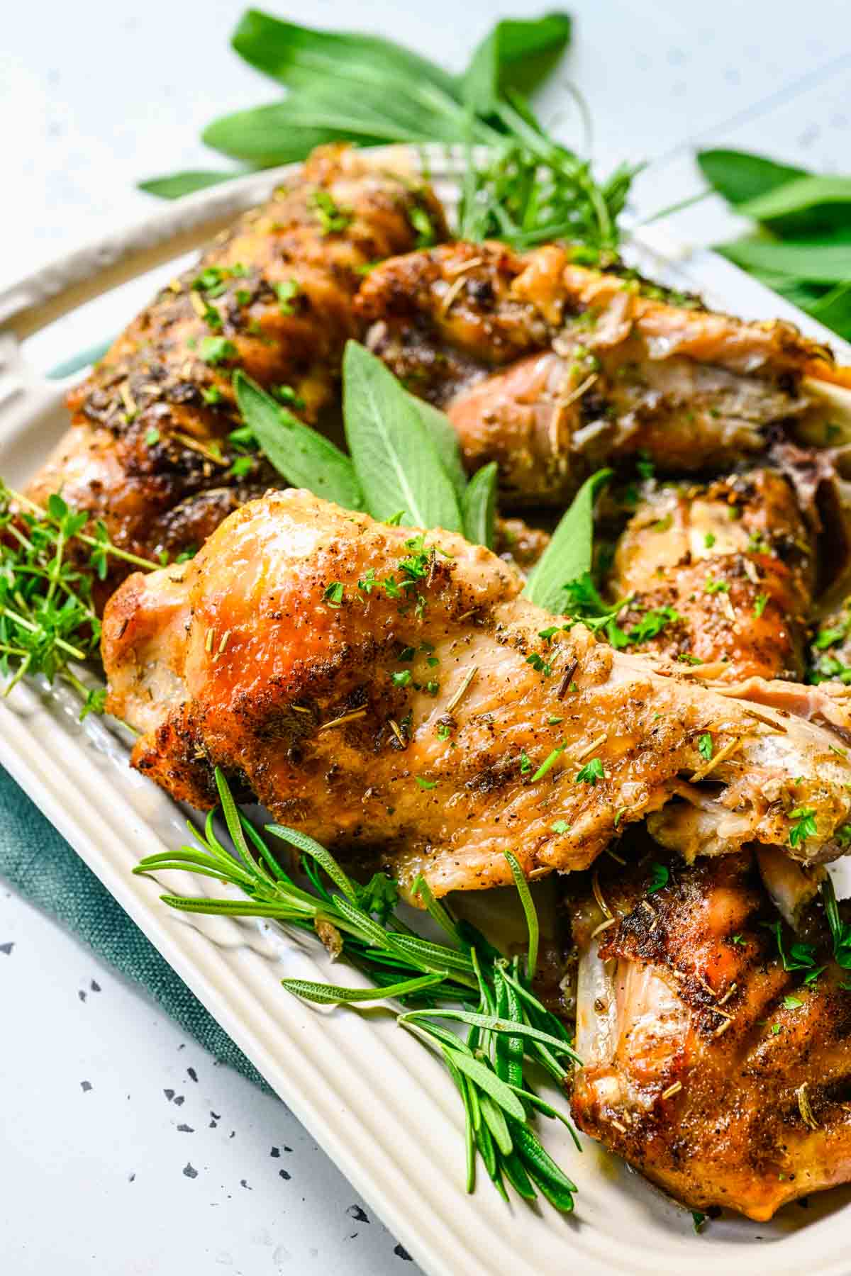 Turkey Wings finished wings with herbs on plate