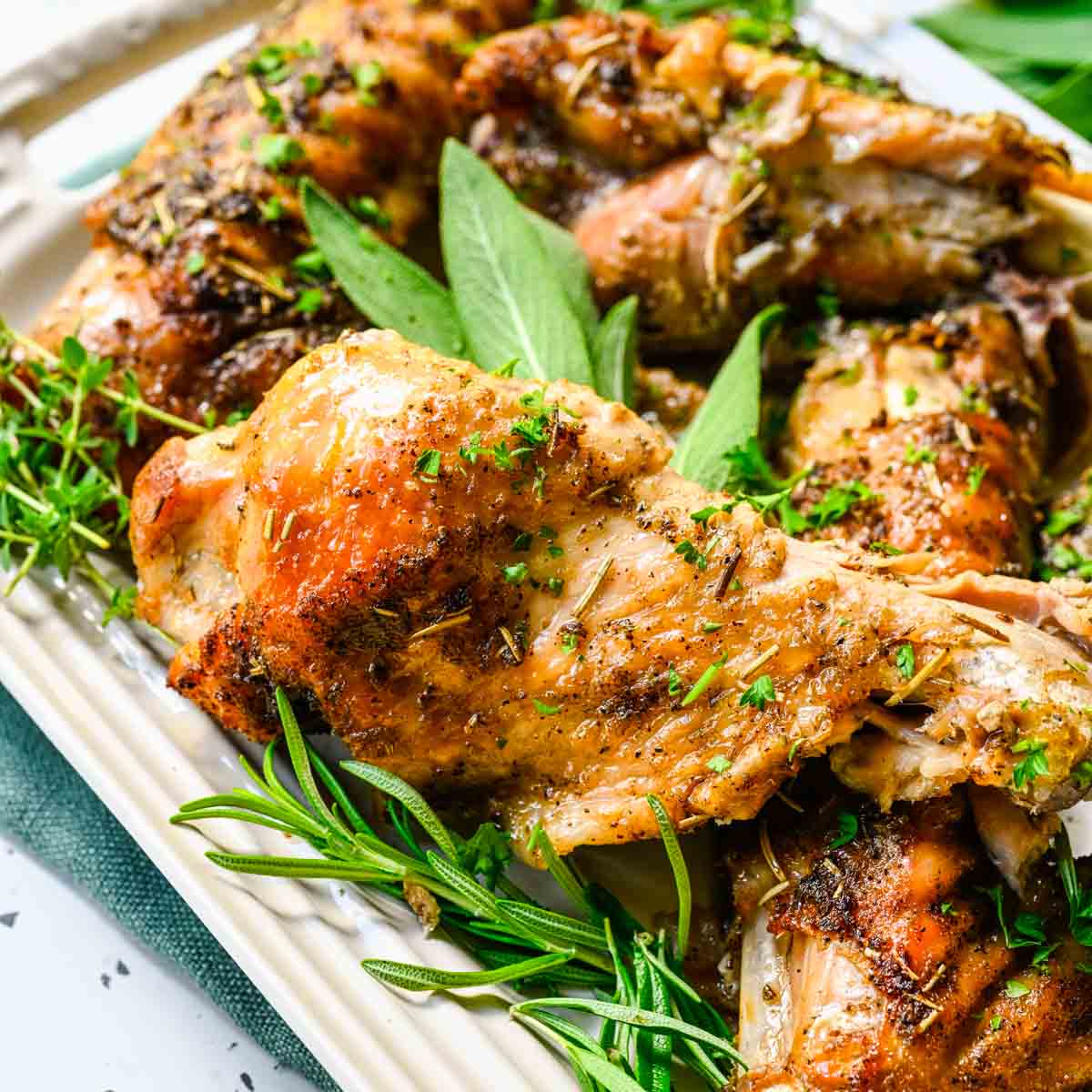 White platter with herbs and wings