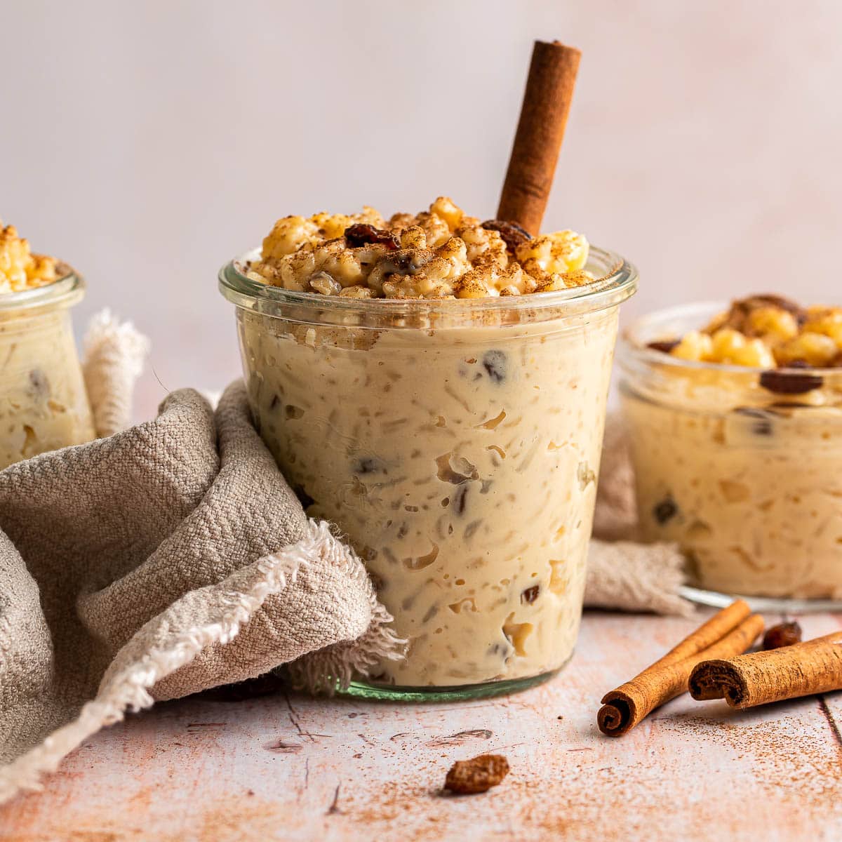 Arroz con Leche finished pudding in glass cup with cinnamon stick