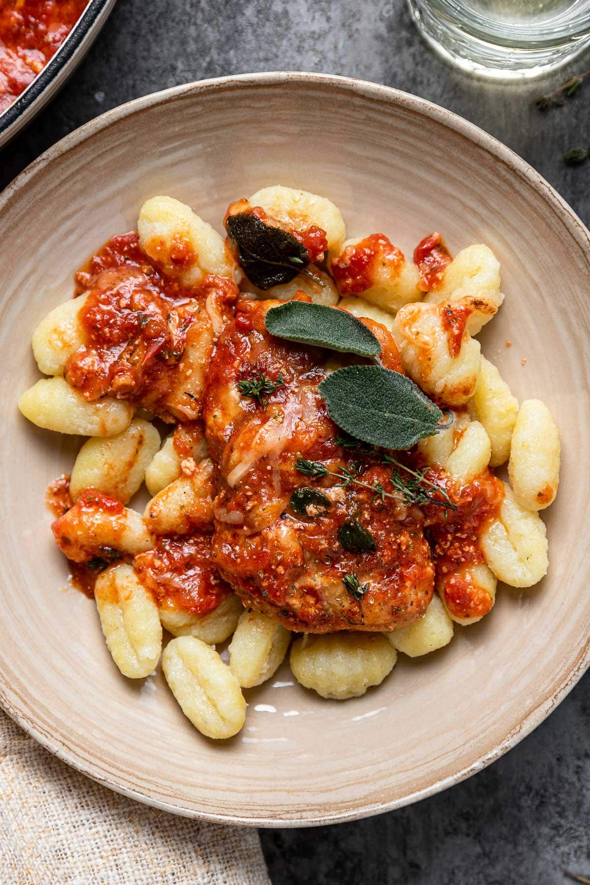 Baked Cheesy Italian Chicken plated over gnocchi