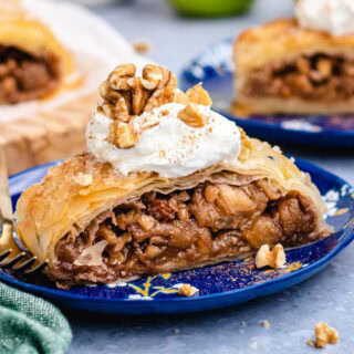 Slice of apple strudel on dessert plate.