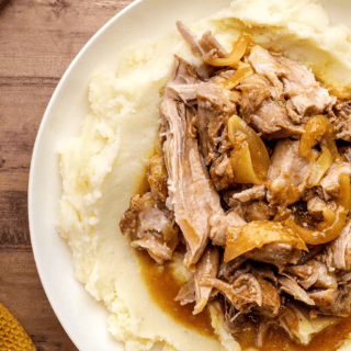Top view of pork on a mashed potatoes