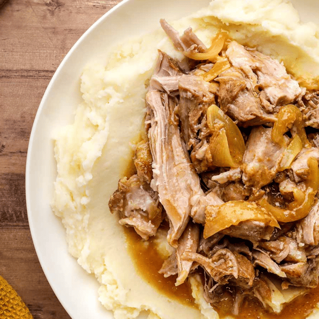 Top view of pork on a mashed potatoes