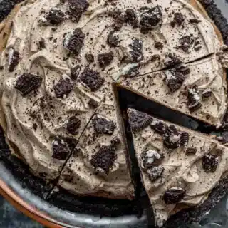 oreo pie from above with a slice being taken out