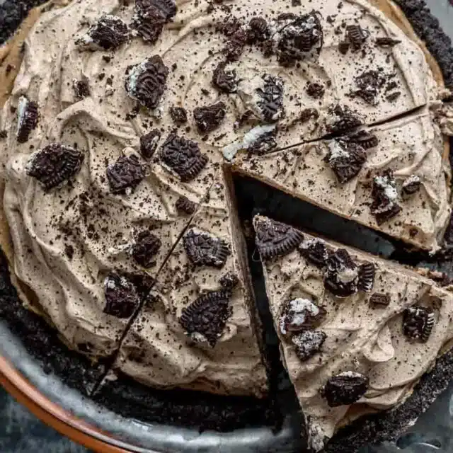 oreo pie from above with a slice being taken out