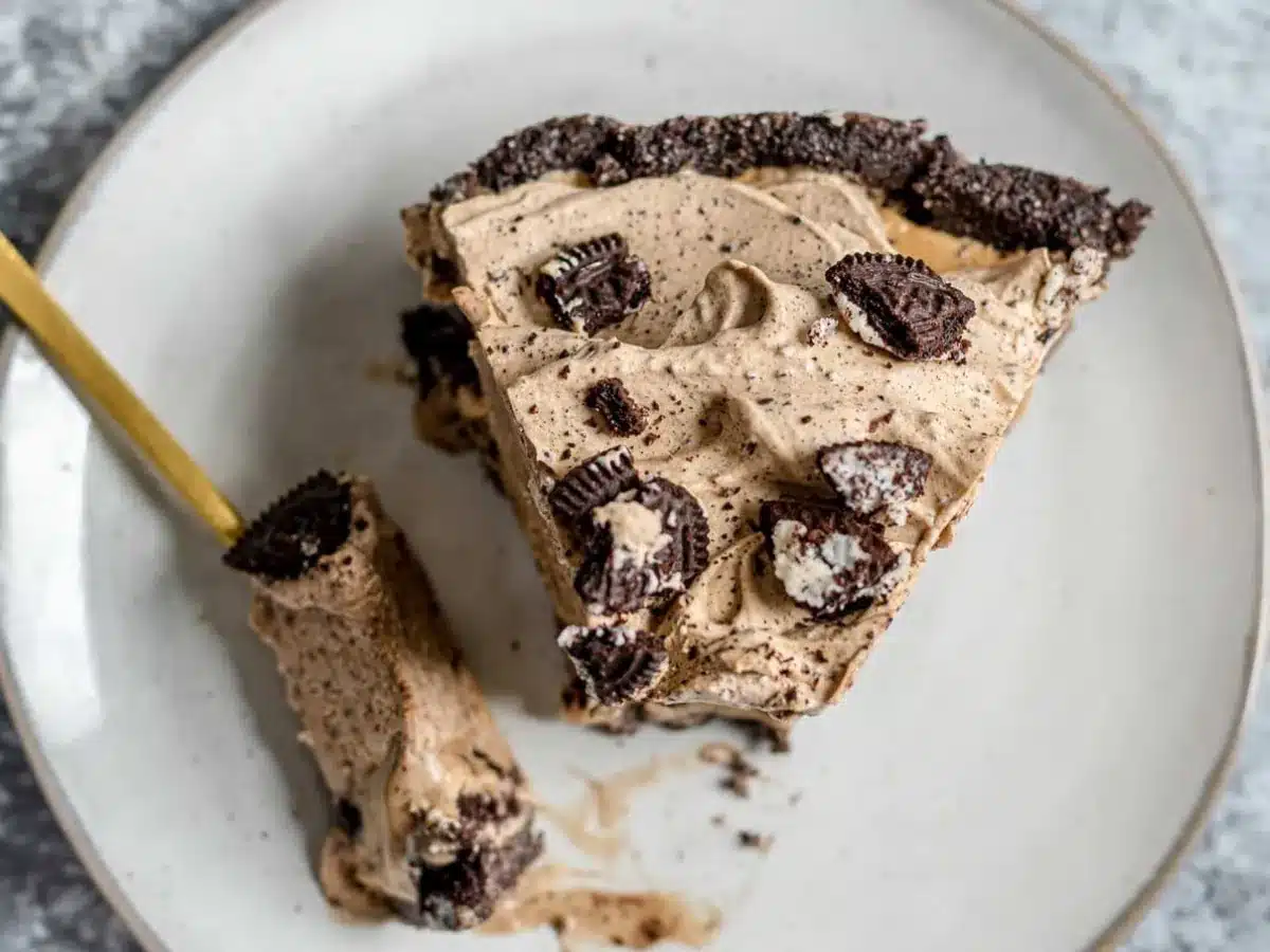slice of Oreo pie on a plate with a fork