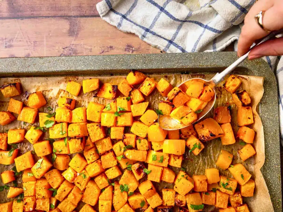 Pan of cubed squash with spoon