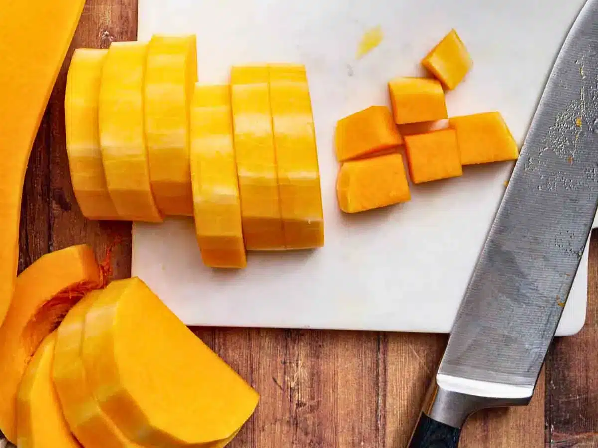 Slices of squash on cutting board with knife