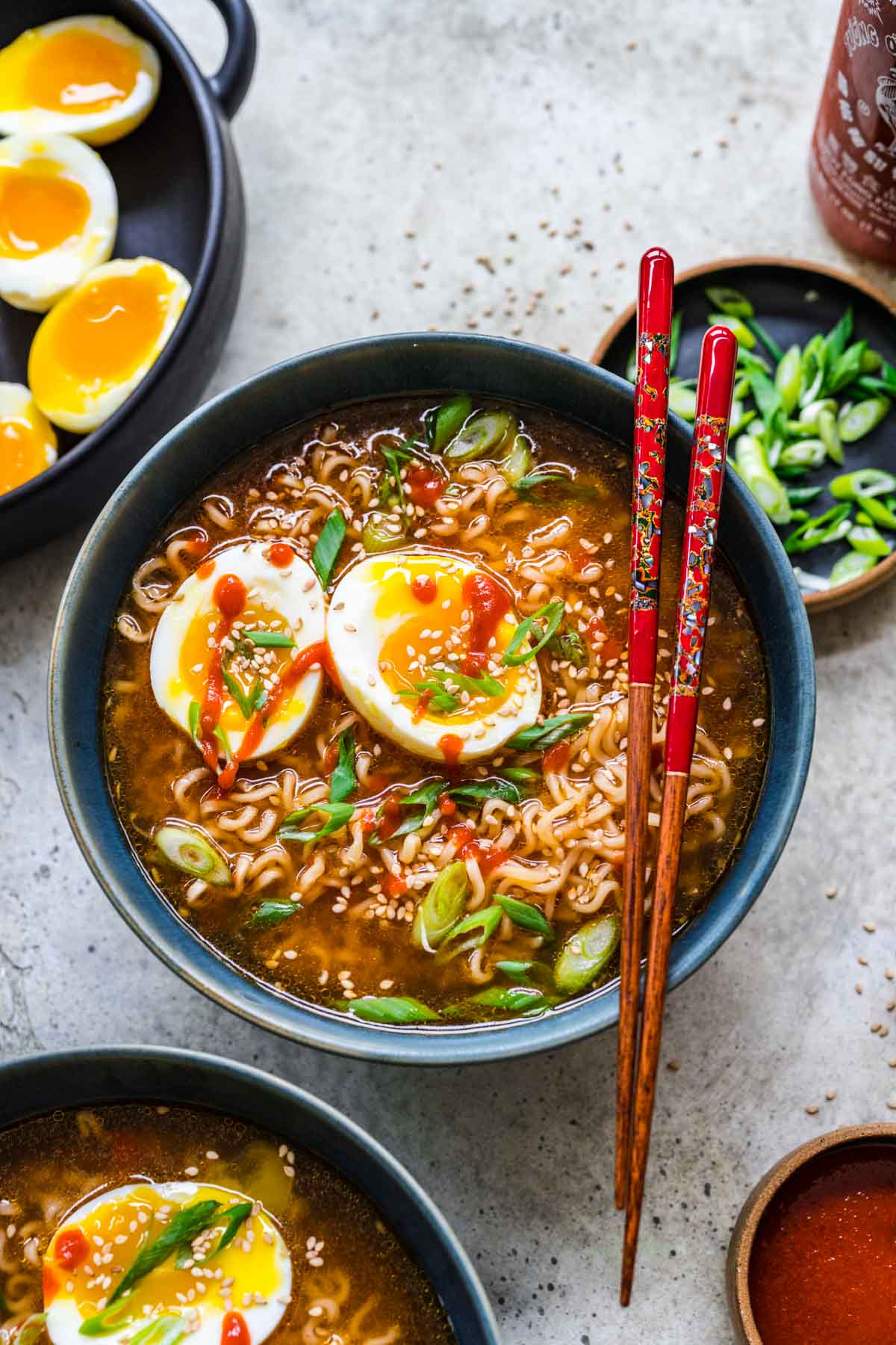 Spicy Ramen finished ramen with toppings in bowl and chopsticks resting on bowl