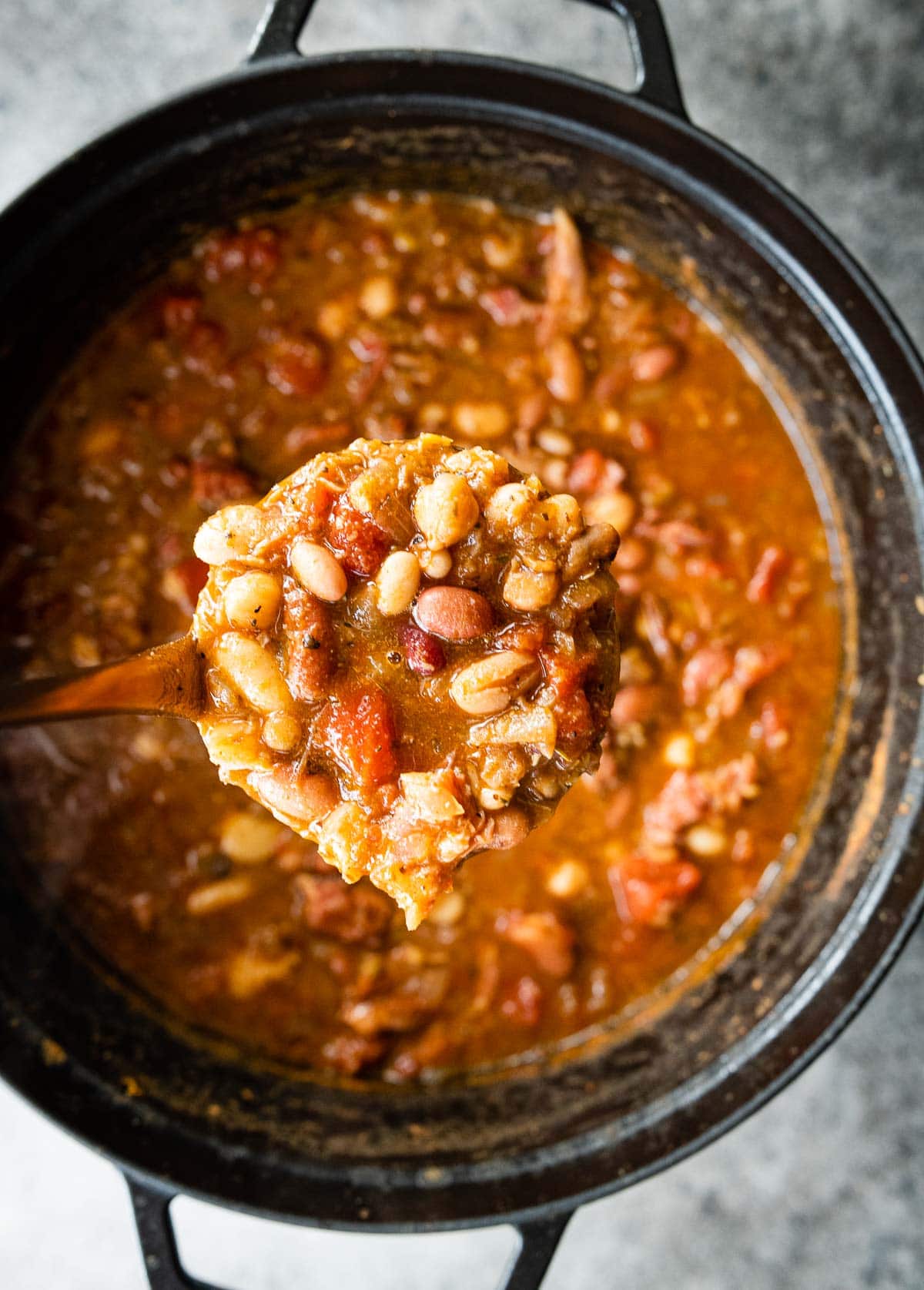 15 Bean Soup cooked soup in pot with soup scooped in ladle