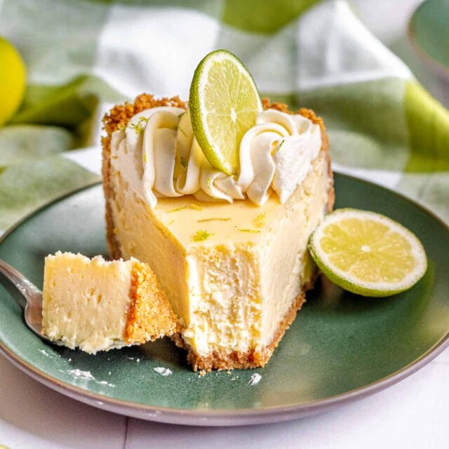 Slice of Key Lime Cheesecake with bite taken
