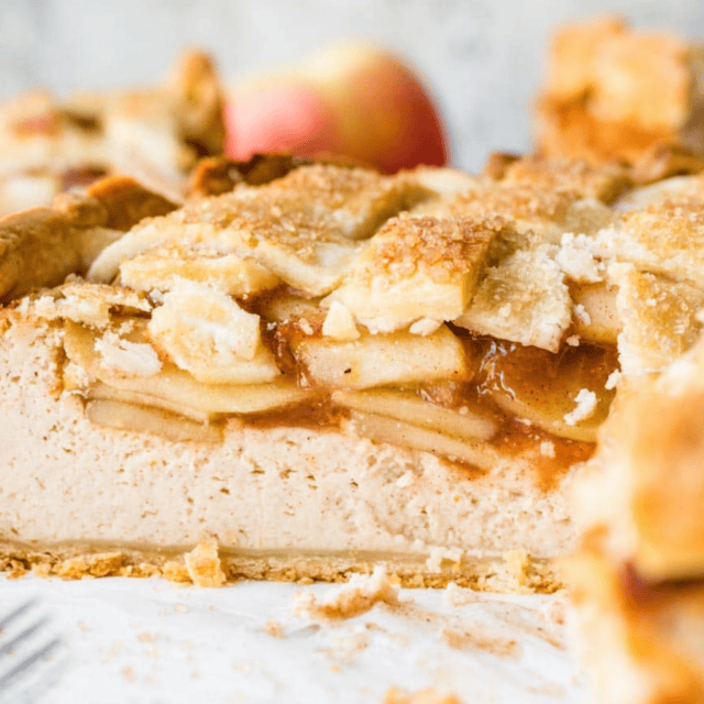 Side view of cheesecake with slice taken out