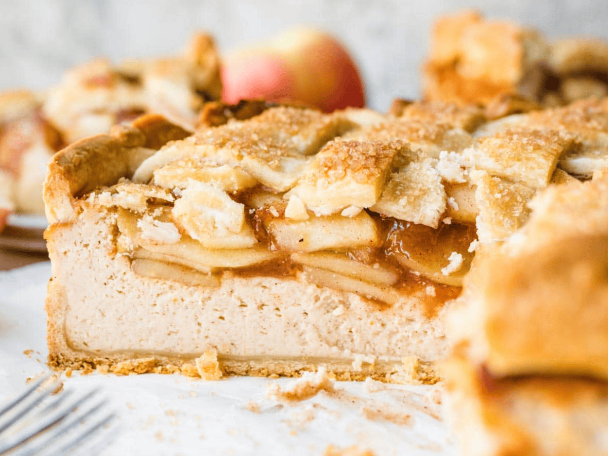 Side view of cheesecake with slice taken out