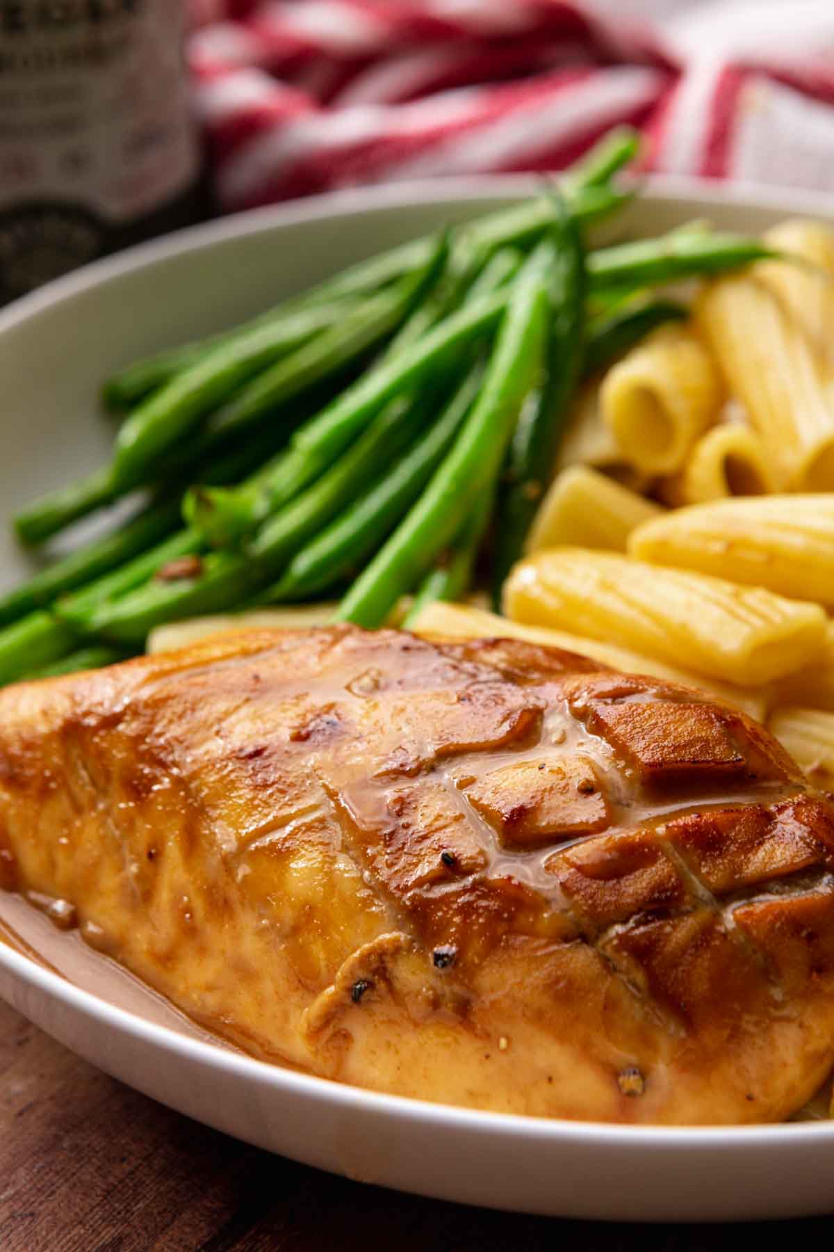 Balsamic Chicken baked chicken breast on plate with asparagus and pasta