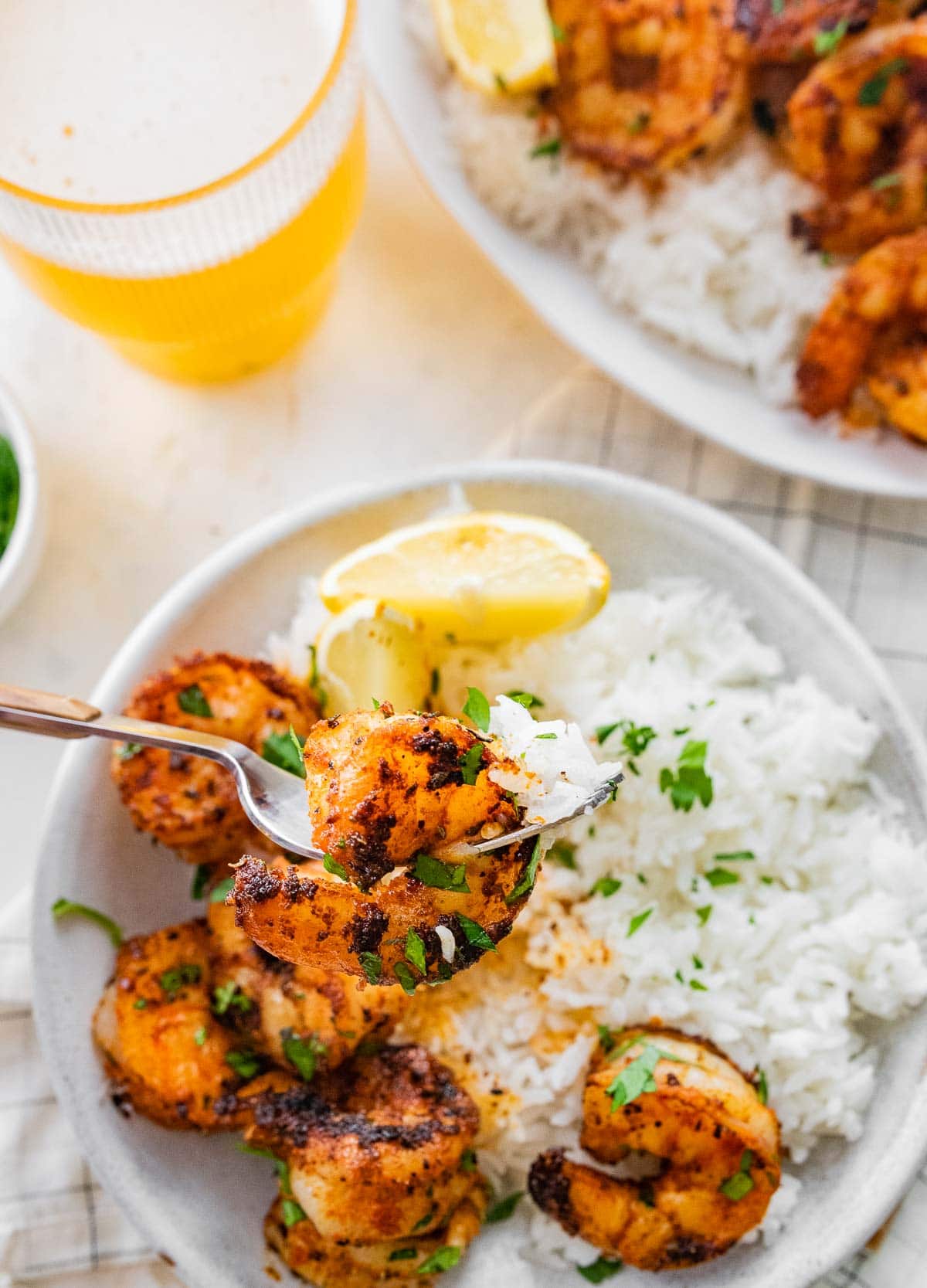 Cajun Shrimp cooked and garnished shrimp on plate with rice