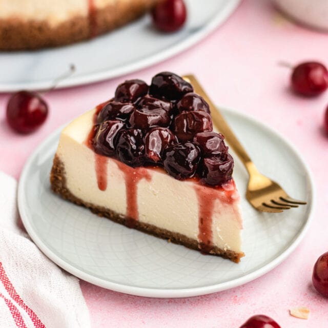 Cherry Cheesecake slice on plate with fork