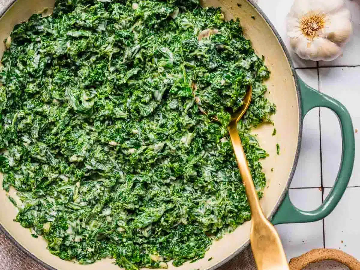 Pot of creamy greens with spoon