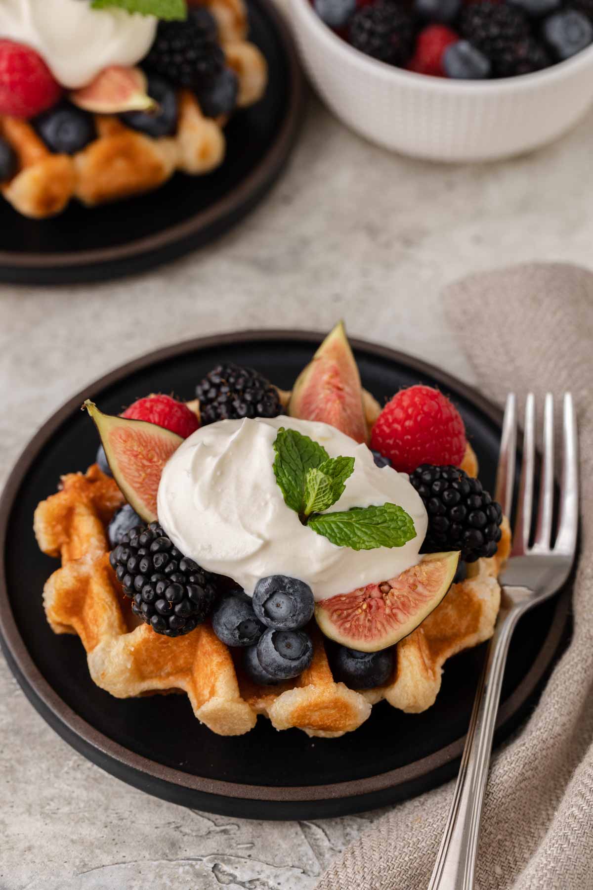 Creme Fraiche finished creme on waffle with fruit and berries