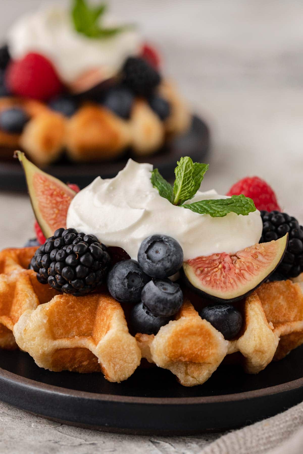 Creme Fraiche finished creme on waffle with fruit and berries