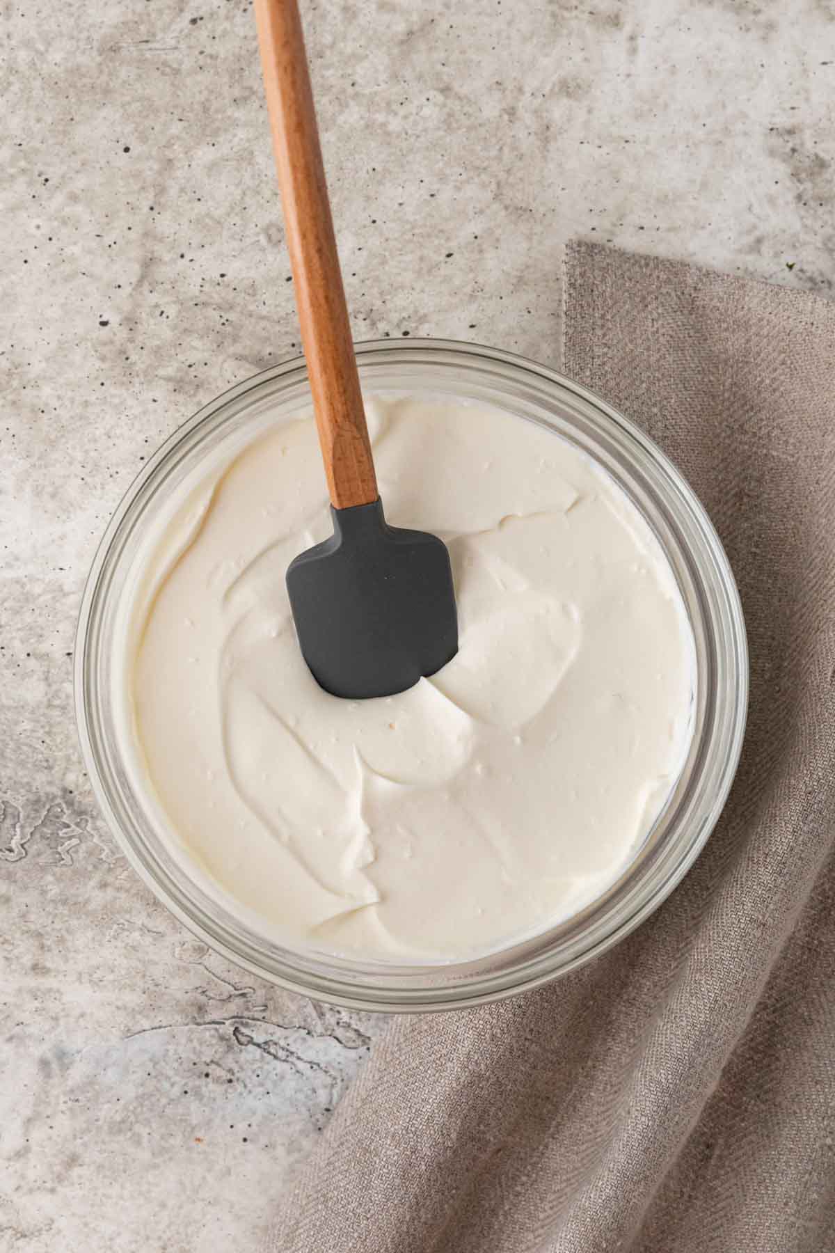 Creme Fraiche finished creme fraiche in mixing bowl with spatula