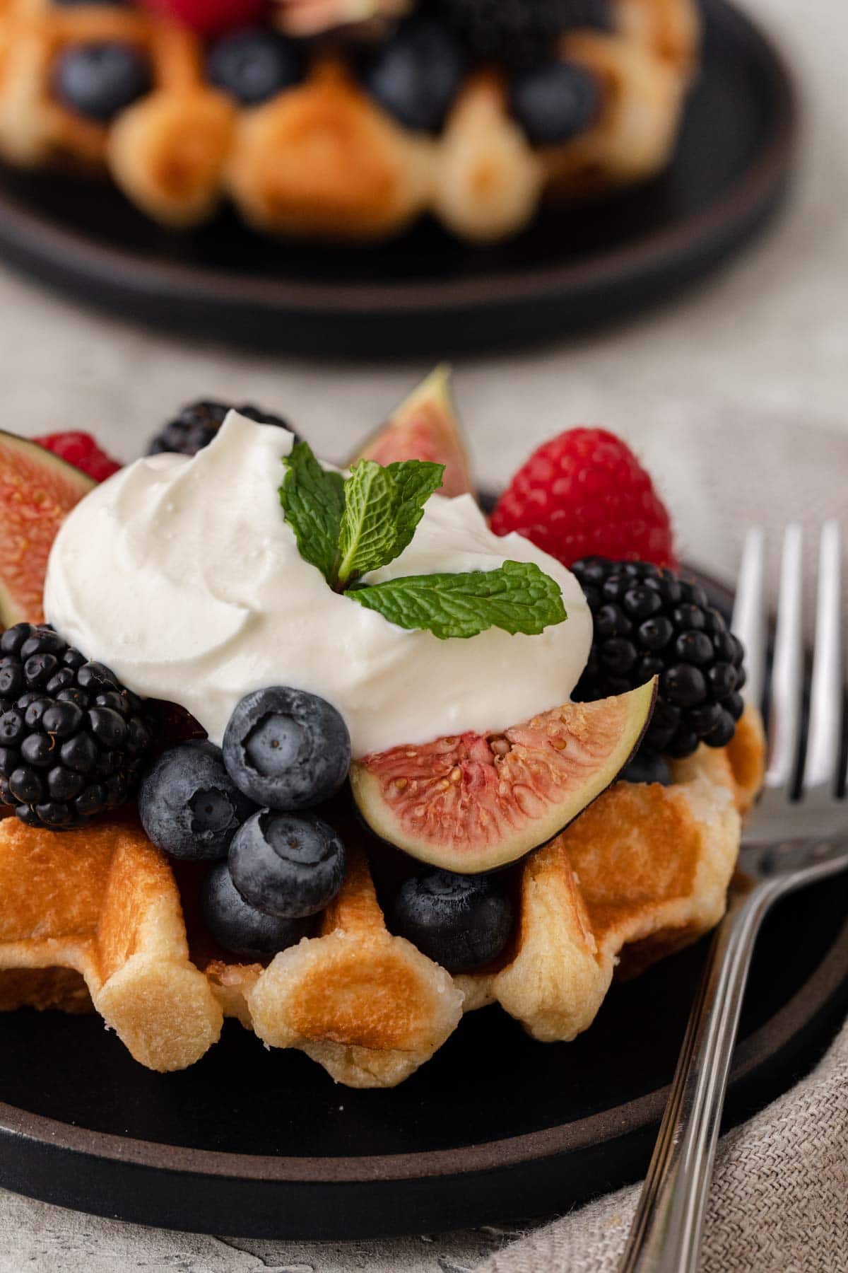 Creme Fraiche finished creme on waffle with fruit and berries