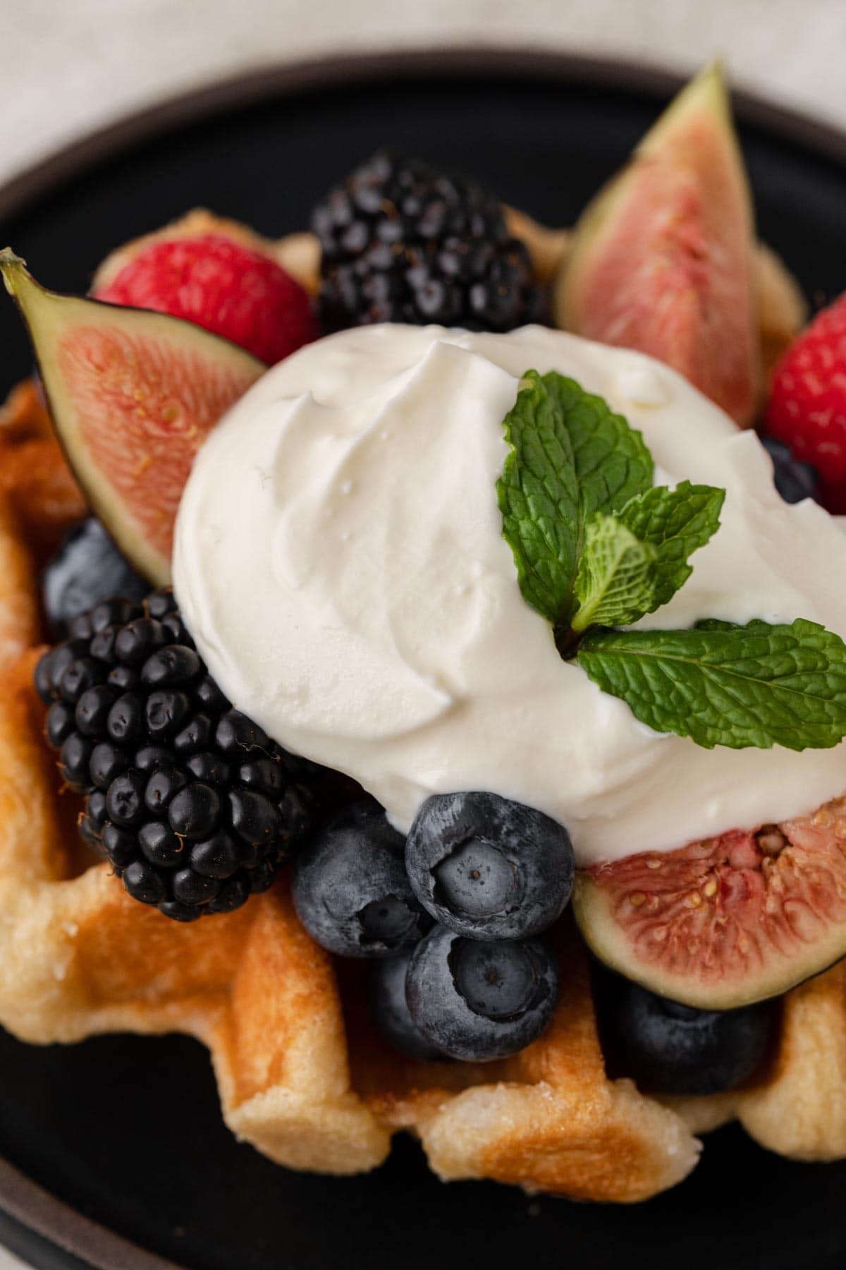 Creme Fraiche finished creme on waffle with fruit and berries