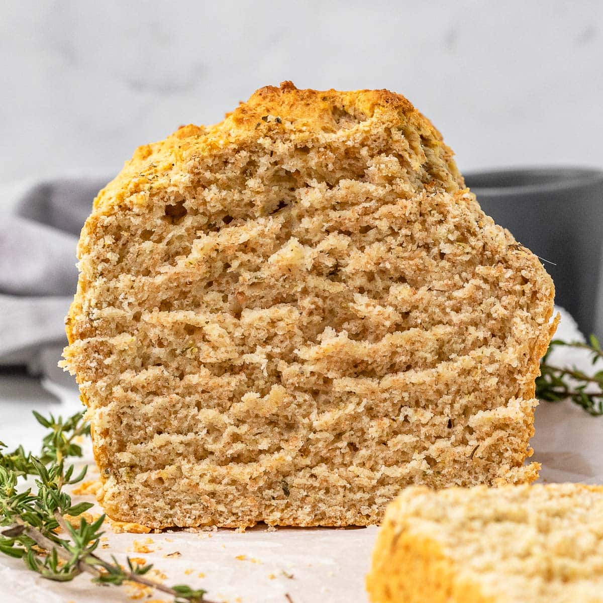 Herb Quick Bread baked bread loaf with slice removed