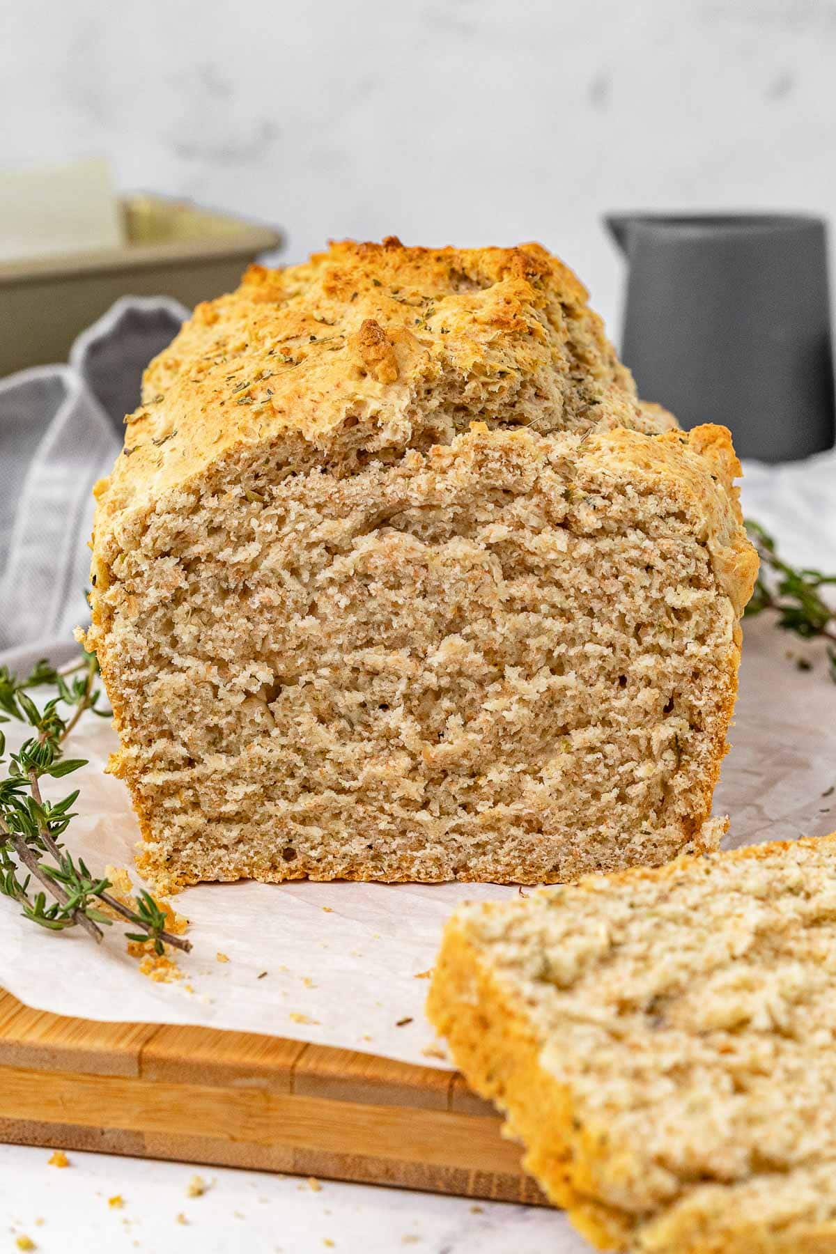 Herb Quick Bread baked bread loaf with slice removed