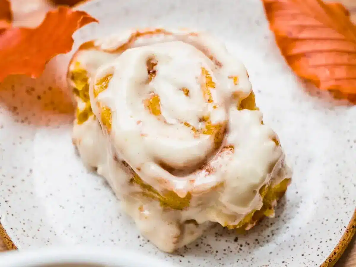Roll with icing on plate