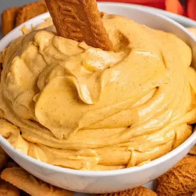 dip on a tray surrounded by cookies