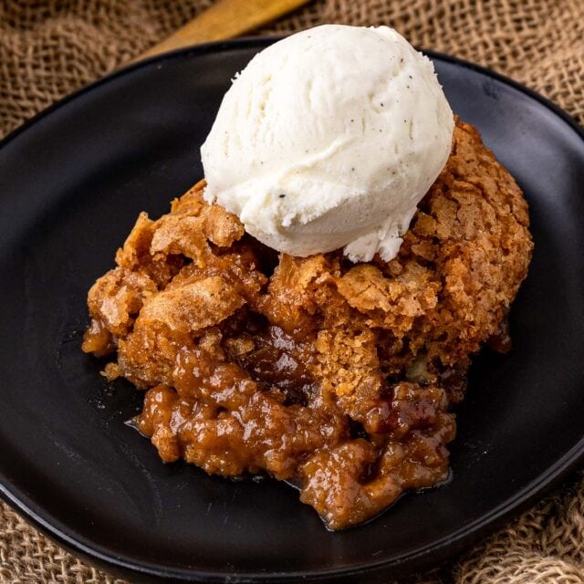 Sweet Potato Cobbler portion on plate with ice cream