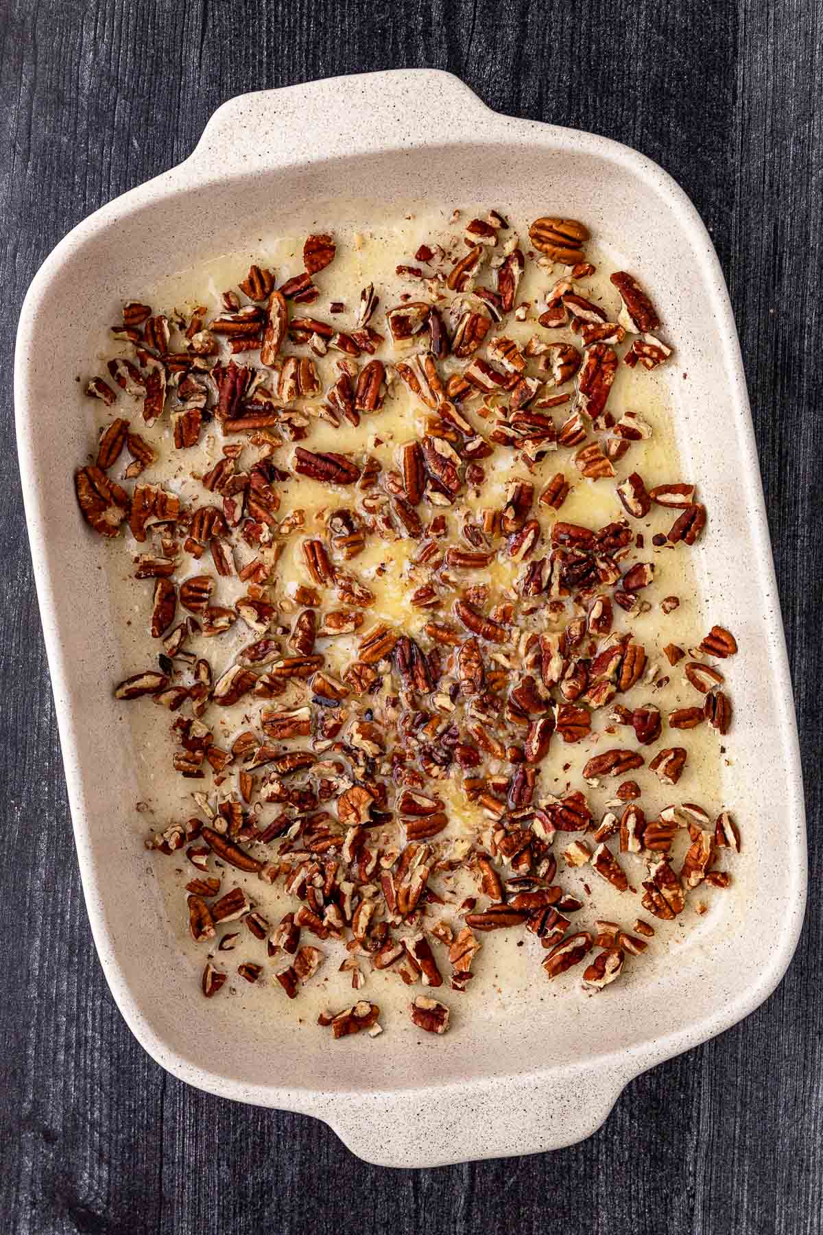 Sweet Potato Cobbler butter and pecans in baking dish