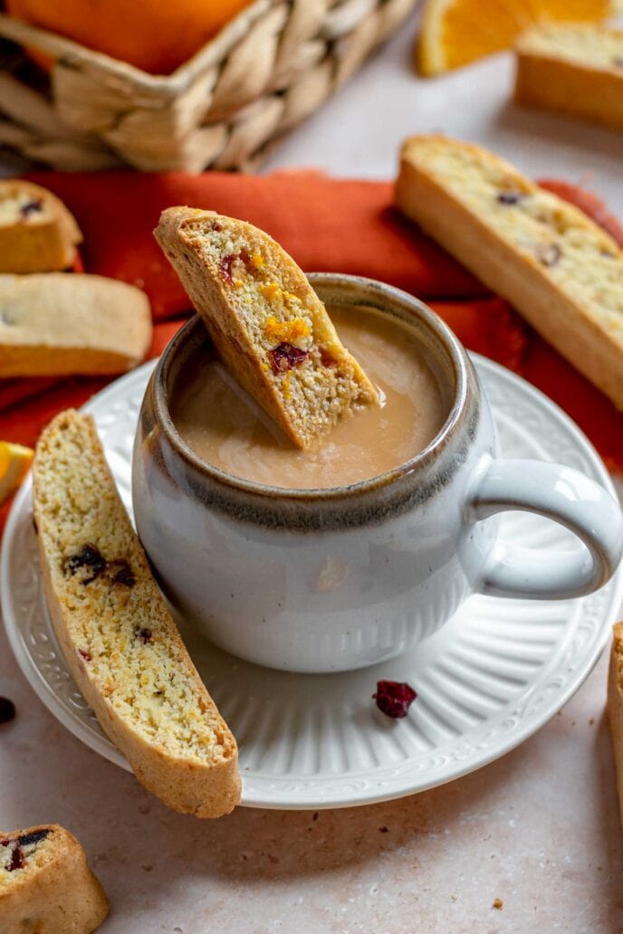 Cranberry Orange Biscotti Cookie dipped in teacup