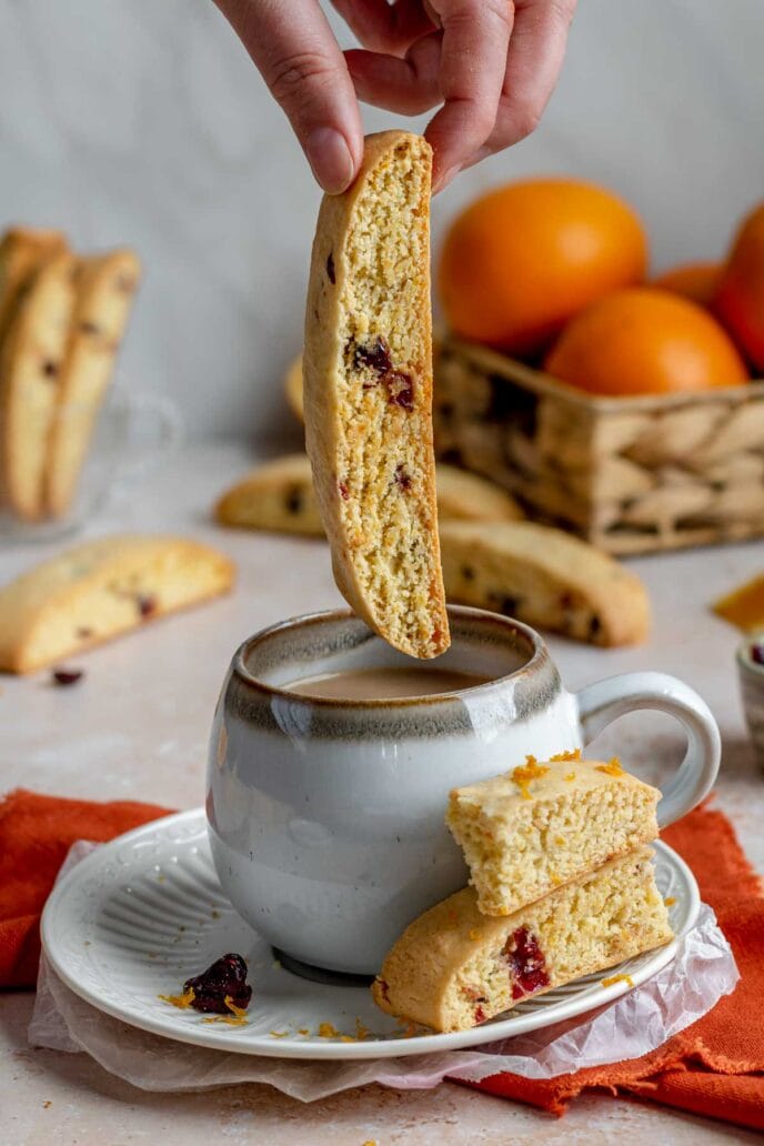 Cranberry Orange Biscotti Cookie dipped in teacup