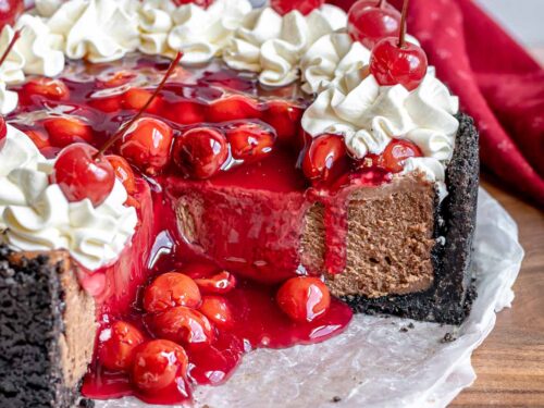 Black Forest Cheesecake finished on plate with slice removed, with ...