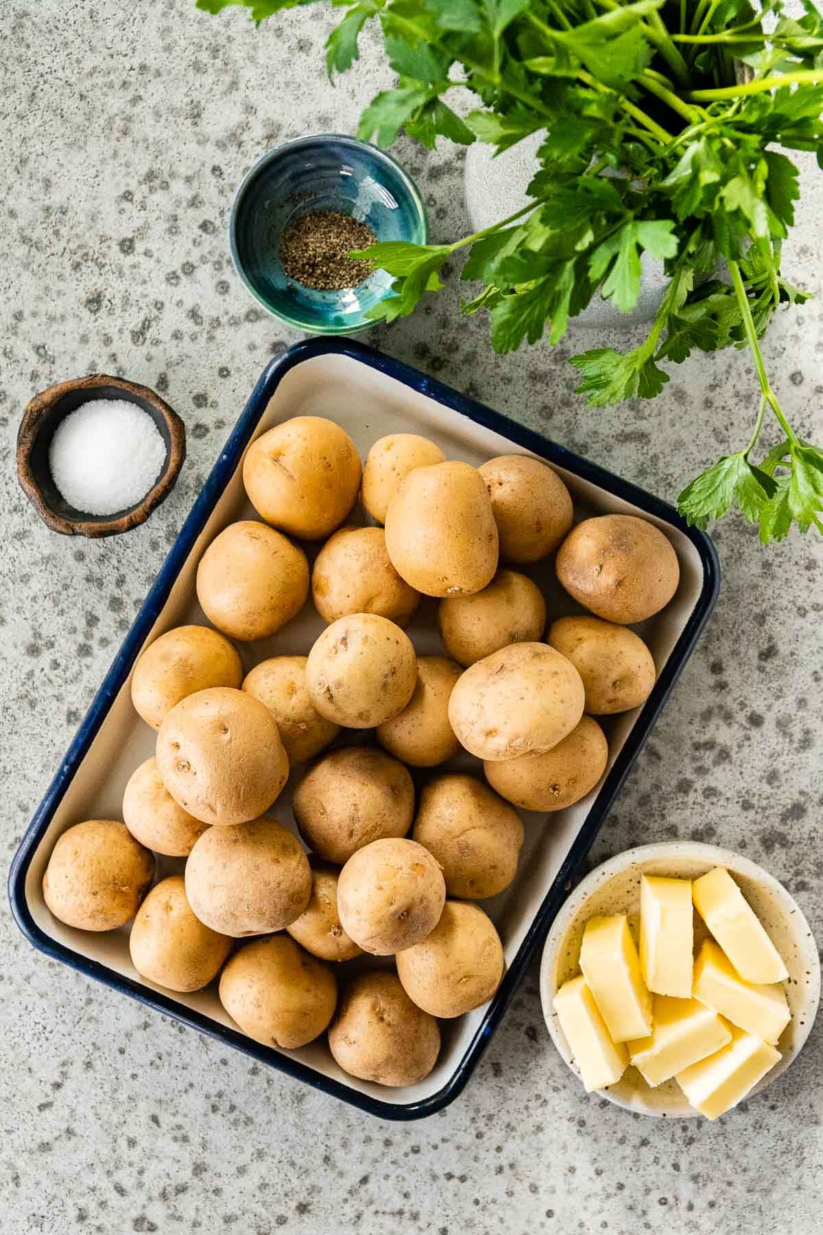 Butter Steamed Baby Potatoes ingredients separated in prep bowls and tray