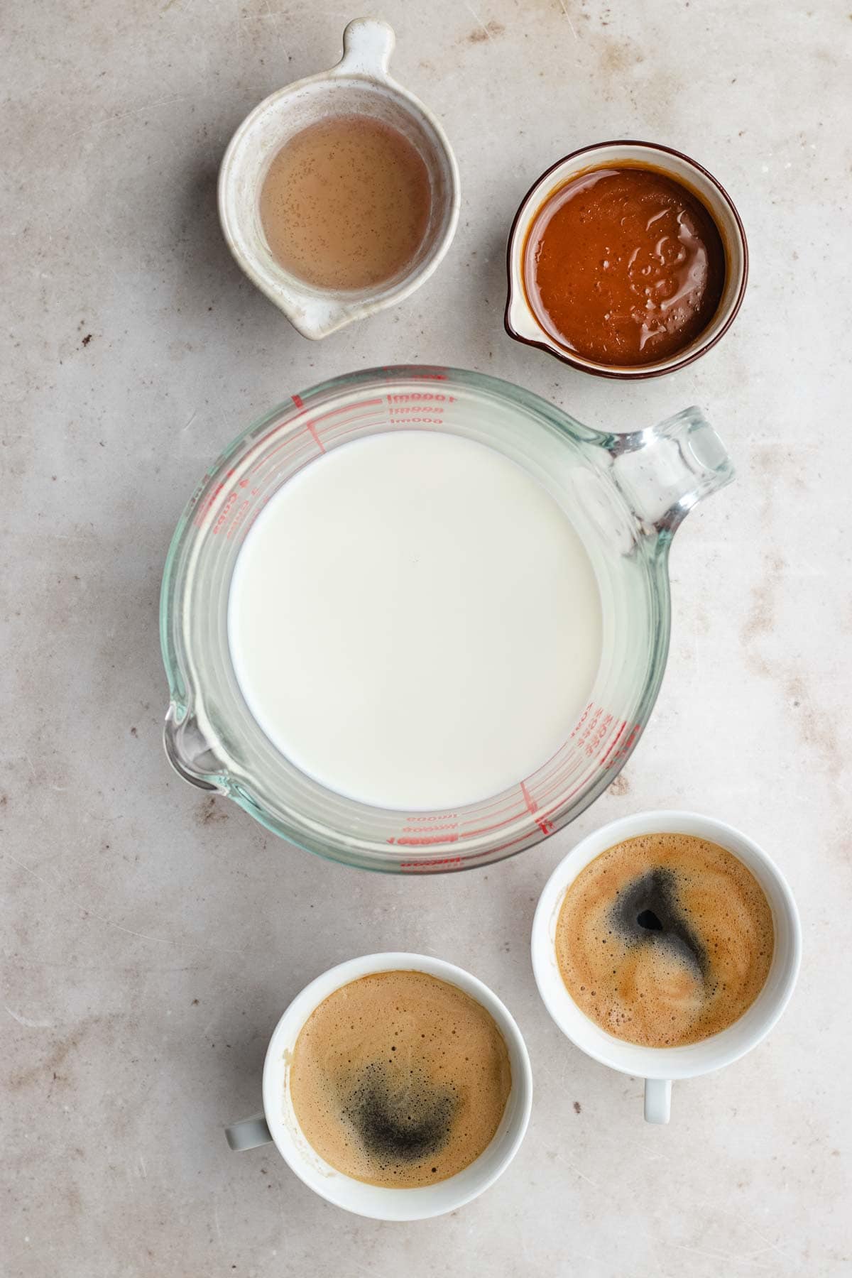 Caramel Macchiato ingredients and espresso in separate cups